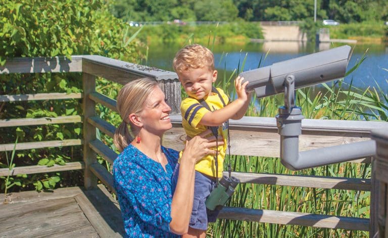 mom and son bird watching