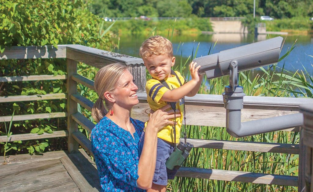 mom and son bird watching