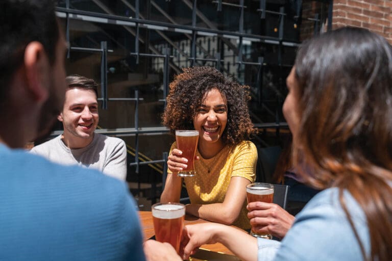 women drinking beer outside